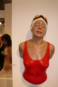 This hyper-real sculpture is offered at $38,000. The cutie in the bathing suit on the left is $55,000, but she has arms.